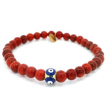 Bracelet 6 mm en corail rouge avec perle œil grec