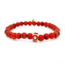 Bracelet 6 mm en corail rouge avec perle œil grec