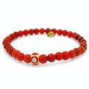 Bracelet 6 mm en corail rouge avec perle œil grec