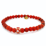 Bracelet 6 mm en corail rouge avec perle œil grec