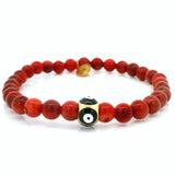 Bracelet 6 mm en corail rouge avec perle œil grec
