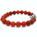 10mm red coral beaded bracelet featuring a leopard head bead accent, displayed on a white background.