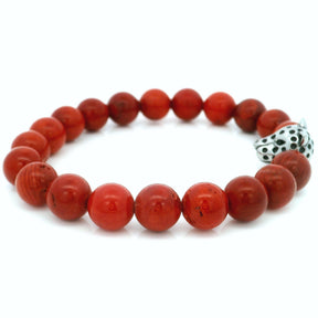 10mm red coral beaded bracelet featuring a leopard head bead accent, displayed on a white background.