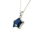 Muonionalusta meteorite star pendant with deep blue sapphire cabochon on a silver rope chain