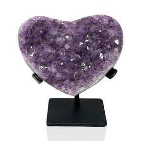 Lavender amethyst crystal heart of even druzy points on a black metal post stand on white