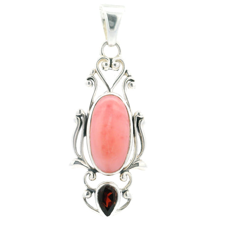 Pink opal pendant featuring an oval cabochon, faceted garnet reverse pear, set in 925 sterling silver with filigree design.