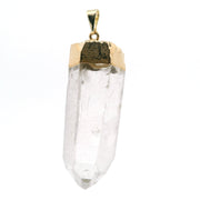 Clear quartz crystal point pendant with plated gold cap and bail, front view on white