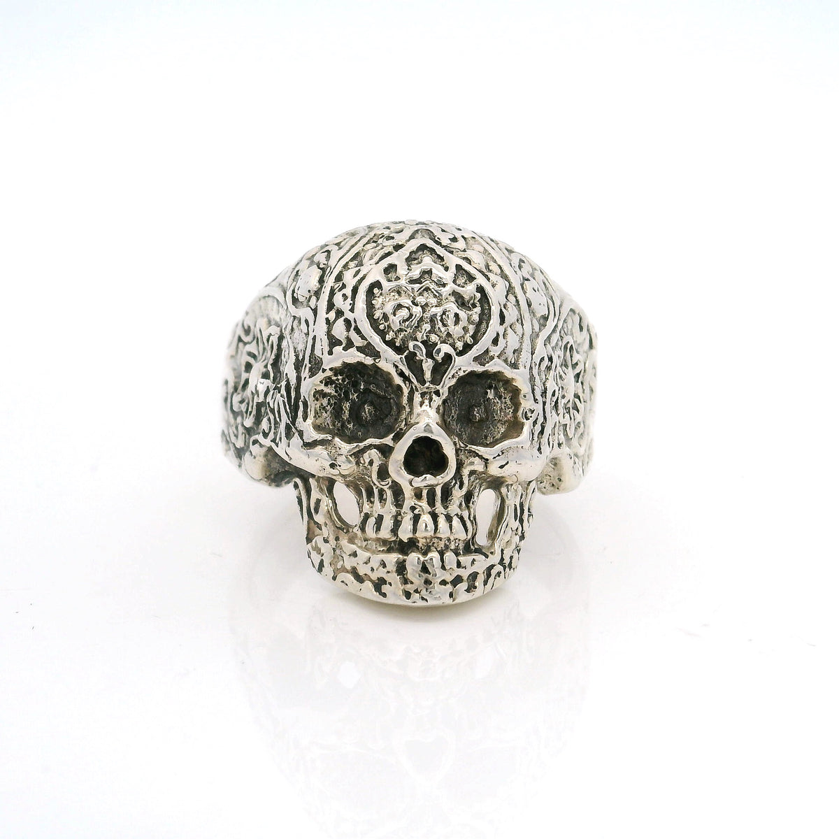 Sterling silver sugar skull ring with ornate filigree carved cranium, front view
