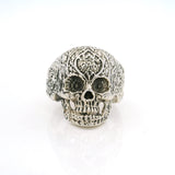 Sterling silver sugar skull ring with ornate filigree carved cranium, front view
