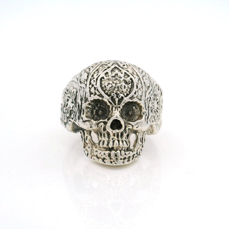 Sterling silver sugar skull ring with ornate filigree carved cranium, front view