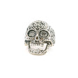 Sterling silver sugar skull ring with floral engraved detail and hollow eye sockets, front view