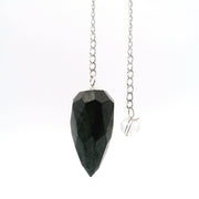 Shungite faceted droplet pendulum hanging from a silver chain, with a clear quartz bead end