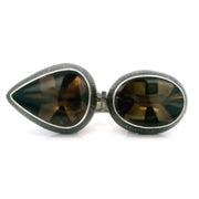 Smoky quartz pear and oval cabochons bezel-set east-west on oxidized 925 silver Double Trouble ring, top view