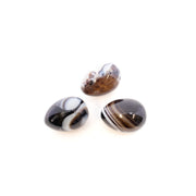 Three small sardonyx carved eggs with brown, black and white banded layers