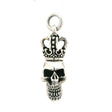 Sterling silver crowned skull pendant with hollow eyes and detailed teeth beneath a royal crown