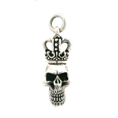 Sterling silver crowned skull pendant with hollow eyes and detailed teeth beneath a royal crown