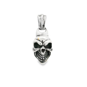 Sterling silver skull pendant with oxidized eye sockets and teeth, front view