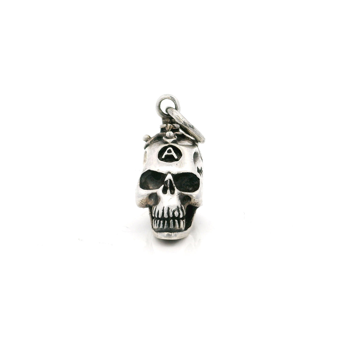 Sterling silver skull pendant with a branded A on the forehead, front view