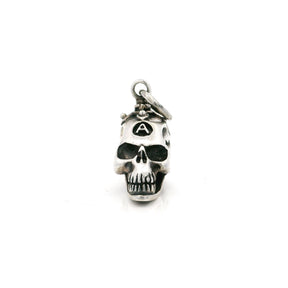 Sterling silver skull pendant with a branded A on the forehead, front view