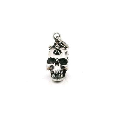 Sterling silver skull pendant with a branded A on the forehead, front view