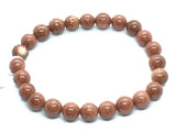 View of 8mm Round Red Goldstone Bracelet