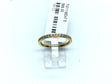Thin gold-tone titanium band lined with white cubic zirconia pave along the crown