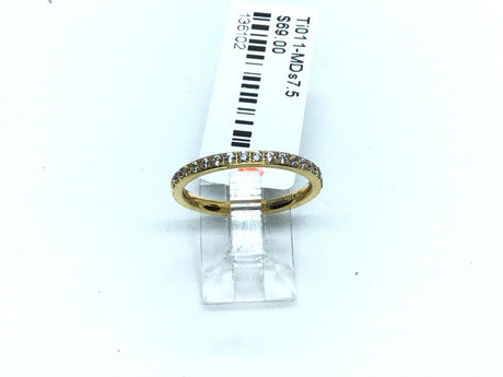 Thin gold-tone titanium band lined with white cubic zirconia pave along the crown