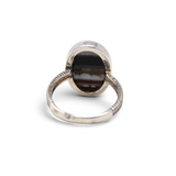 Back of banded agate ring showing open silver bezel and braided sterling band, size 10