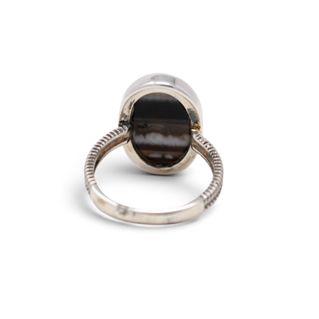Back of banded agate ring showing open silver bezel and braided sterling band, size 10