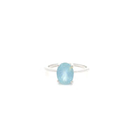 Oval aquamarine solitaire ring prong set in a rhodium vermeil band, top view