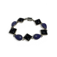 Rare Earth Gallery link bracelet featuring alternating teardrop lapis lazuli and square black onyx stones in silver
