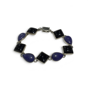 Rare Earth Gallery link bracelet featuring alternating teardrop lapis lazuli and square black onyx stones in silver