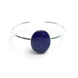 Rare Earth Gallery lapis lazuli cuff bracelet featuring a wide oval cabochon stone in a simple silver bezel setting.