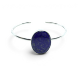 Rare Earth Gallery lapis lazuli cuff bracelet featuring a wide oval cabochon stone in a simple silver bezel setting.