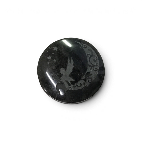 Small round black obsidian cabochon etched with a fairy perched on a scrolled crescent moon and stars