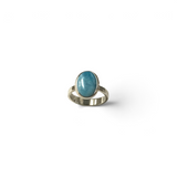 Rare Earth Gallery Larimar ring featuring a simple oval cabochon stone set in a raised silver bezel.