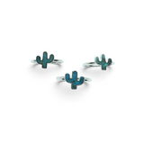 Rare Earth Gallery sterling silver rings featuring turquoise cactus-shaped bezel settings