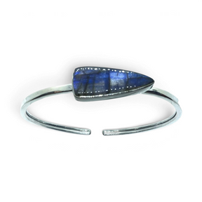 Rare Earth Gallery labradorite twist bracelet featuring an east-west set pennant cabochon in a silver bezel setting.