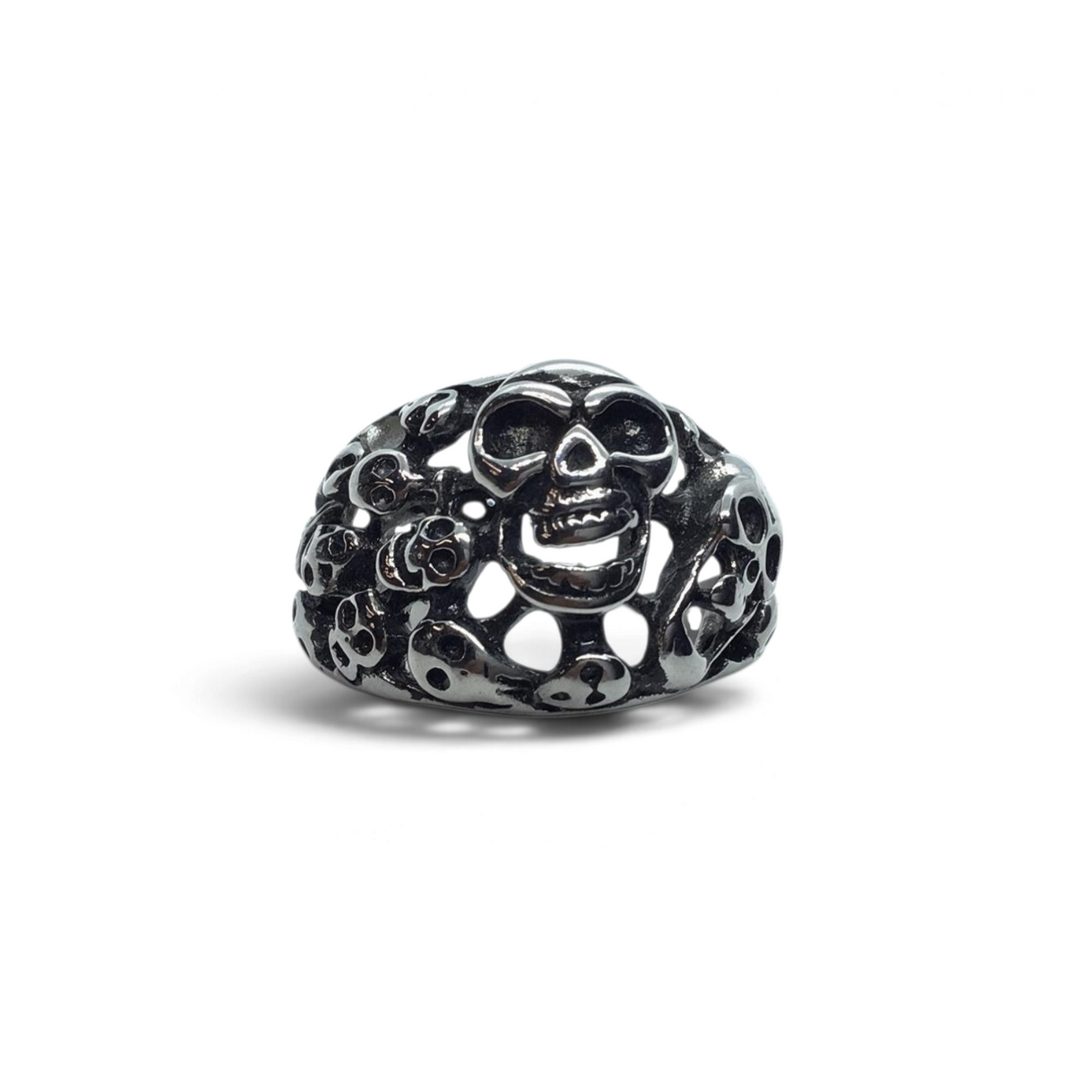 Rare Earth Gallery stainless steel ring featuring an intricate multi-skull design with a polished metallic finish.
