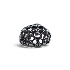 Rare Earth Gallery stainless steel ring featuring an intricate multi-skull design with a polished metallic finish.