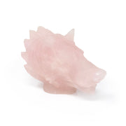 Rose quartz wolf head carving with frosted pink finish and detailed mane, angled view