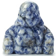 Sodalite Buddha carving in mottled blue and white, seated laughing figure with hands on knees, front view