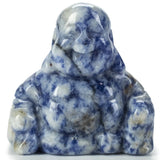 Sodalite Buddha carving in mottled blue and white, seated laughing figure with hands on knees, front view