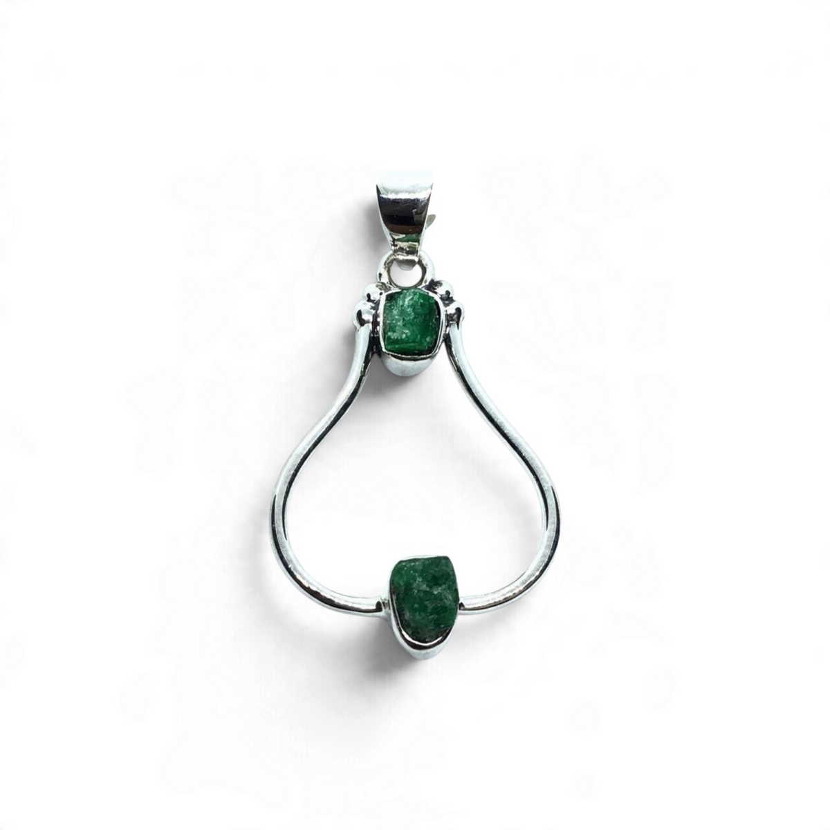 Rare Earth Gallery emerald pendant featuring two rough green freeform stones in 925 sterling silver open settings.