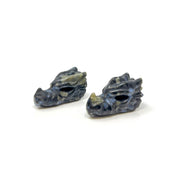 Two indigo gabbro mystic merlinite dragon skull carvings with blue mottling