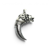 Rare Earth Gallery Muonionalusta meteorite claw pendant featuring a 925 sterling silver wolf head with swirl accents.