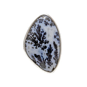 Dendritic opal ring with organic oval cabochon, blue-white base and black fern-like dendrites in silver bezel