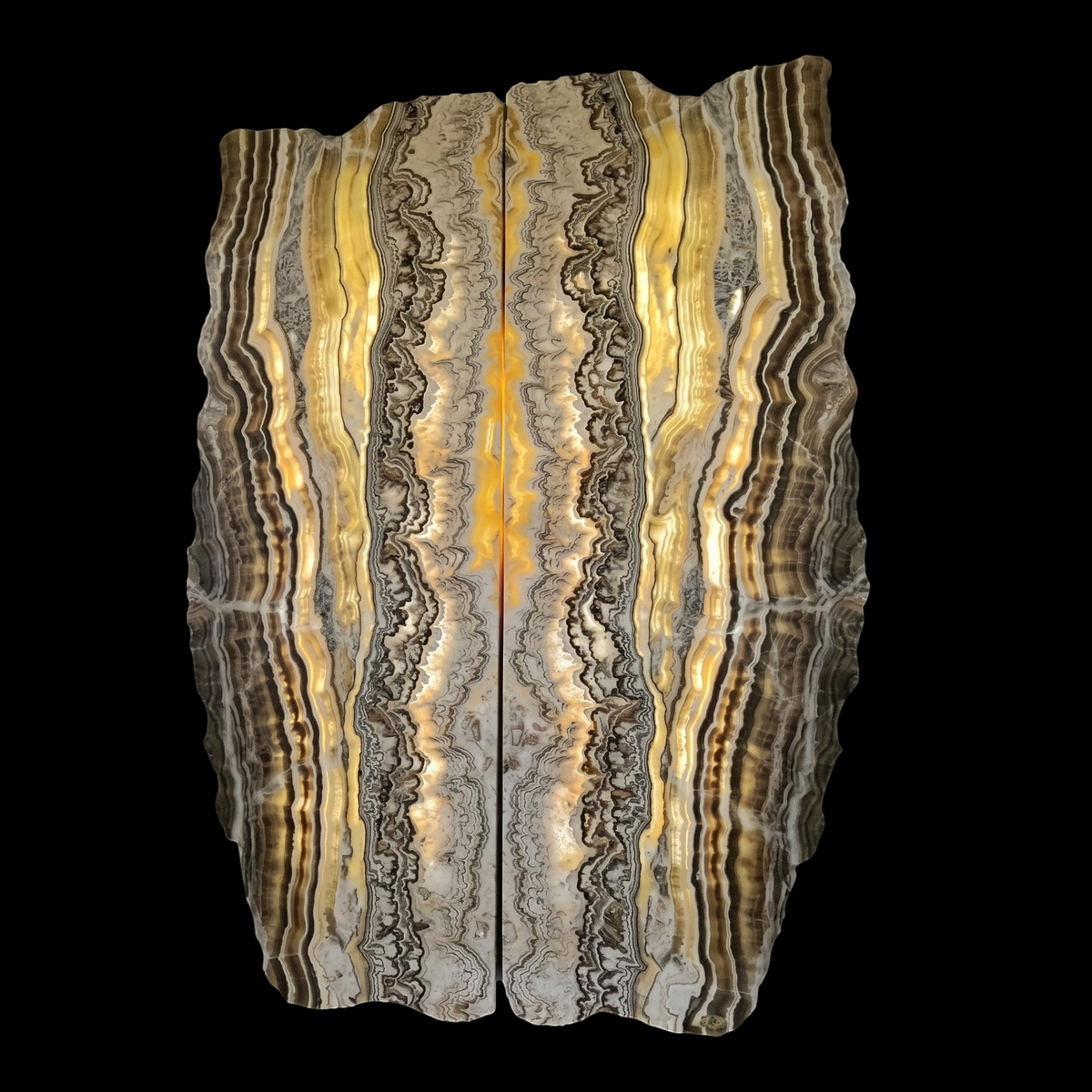 Rare Earth Gallery backlit Zebra Onyx diptych wall panels with irregular live-edge borders and flowing brown gold veins.
