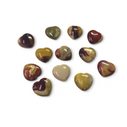 Rare Earth Gallery collection of polished Mookaite Jasper heart-shaped stones in various earthy red and yellow tones.
