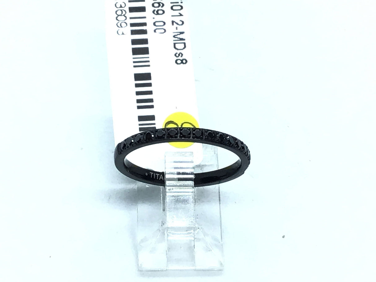 Thin black titanium band lined with black cubic zirconia pave along the crown